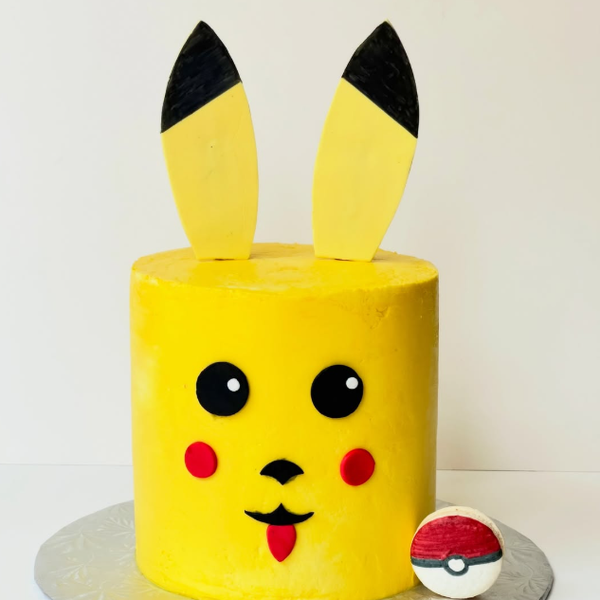 Two-tiered Batman themed custom birthday cake made with Chocolate sponge and chocolate ganache